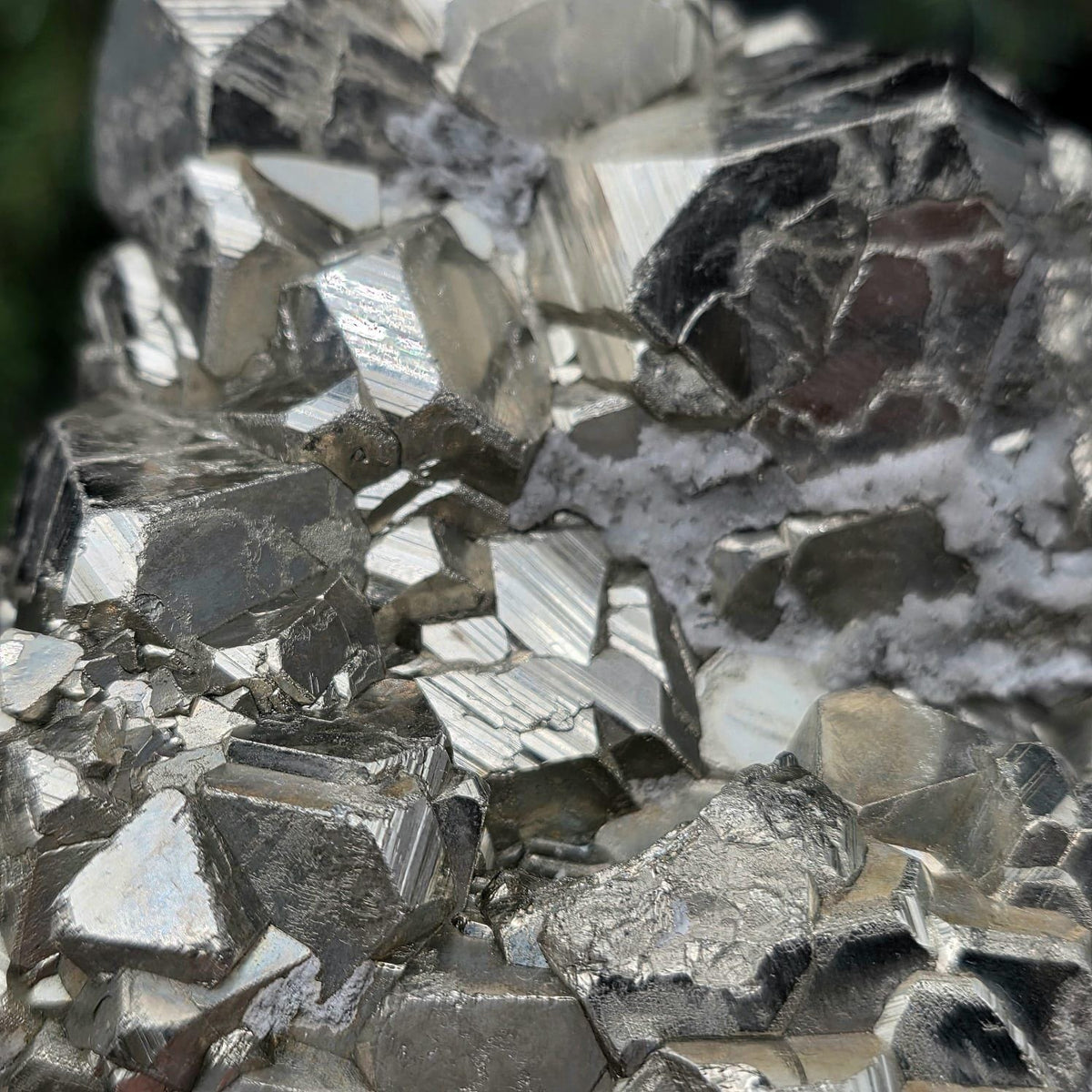 Natural Pyrite cluster from Peru displaying pyritohedral crystal habits.