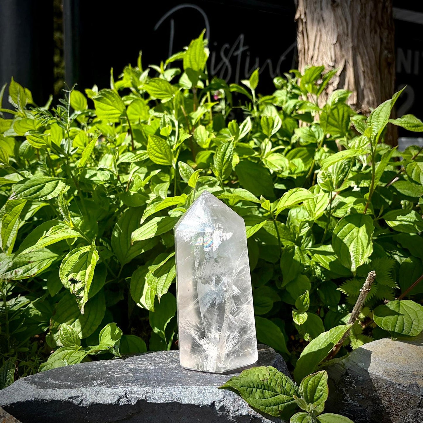 Natural quartz crystal tower from Madagascar, polished into a tall decorative prism shape.