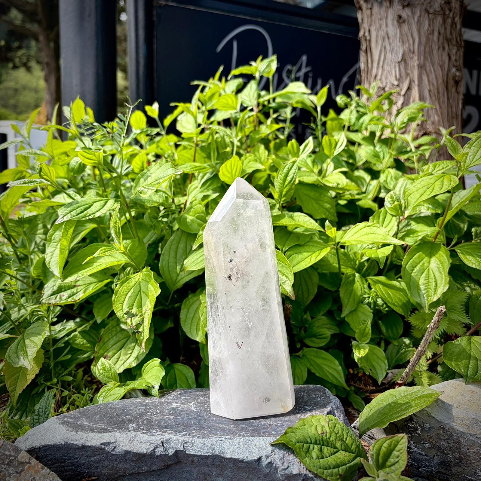 Natural quartz tower shaped and polished into a decorative crystal prism.