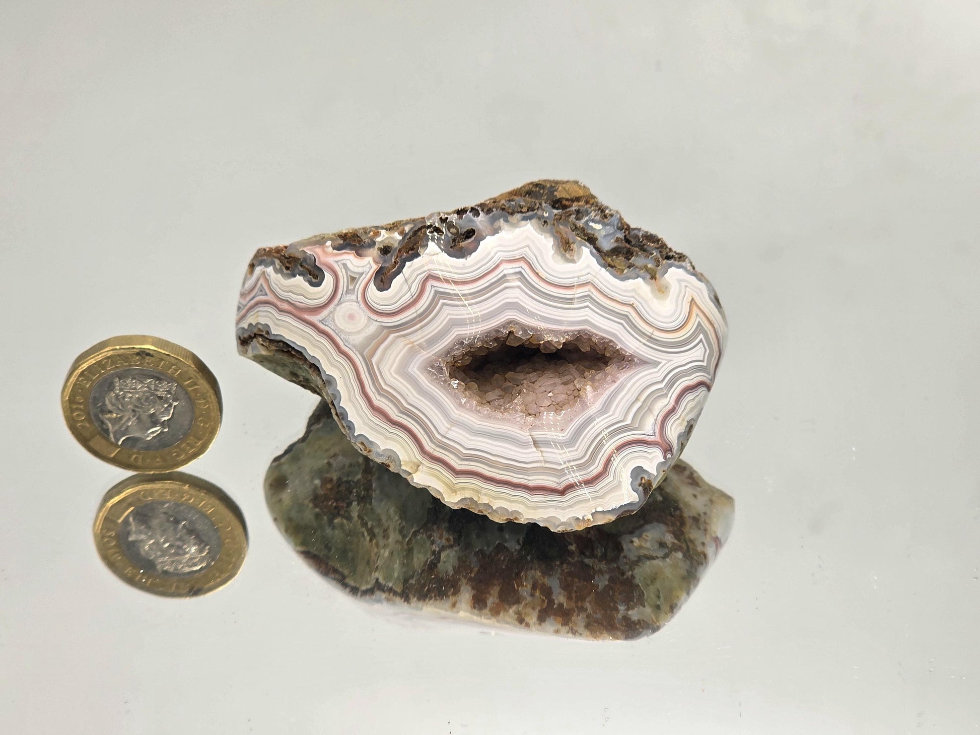 Natural textured Malawi Agate polished geode.