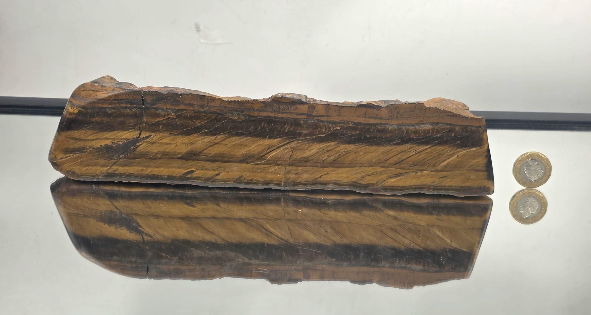 Natural Tiger’s Eye display slab showing golden shimmer and banding