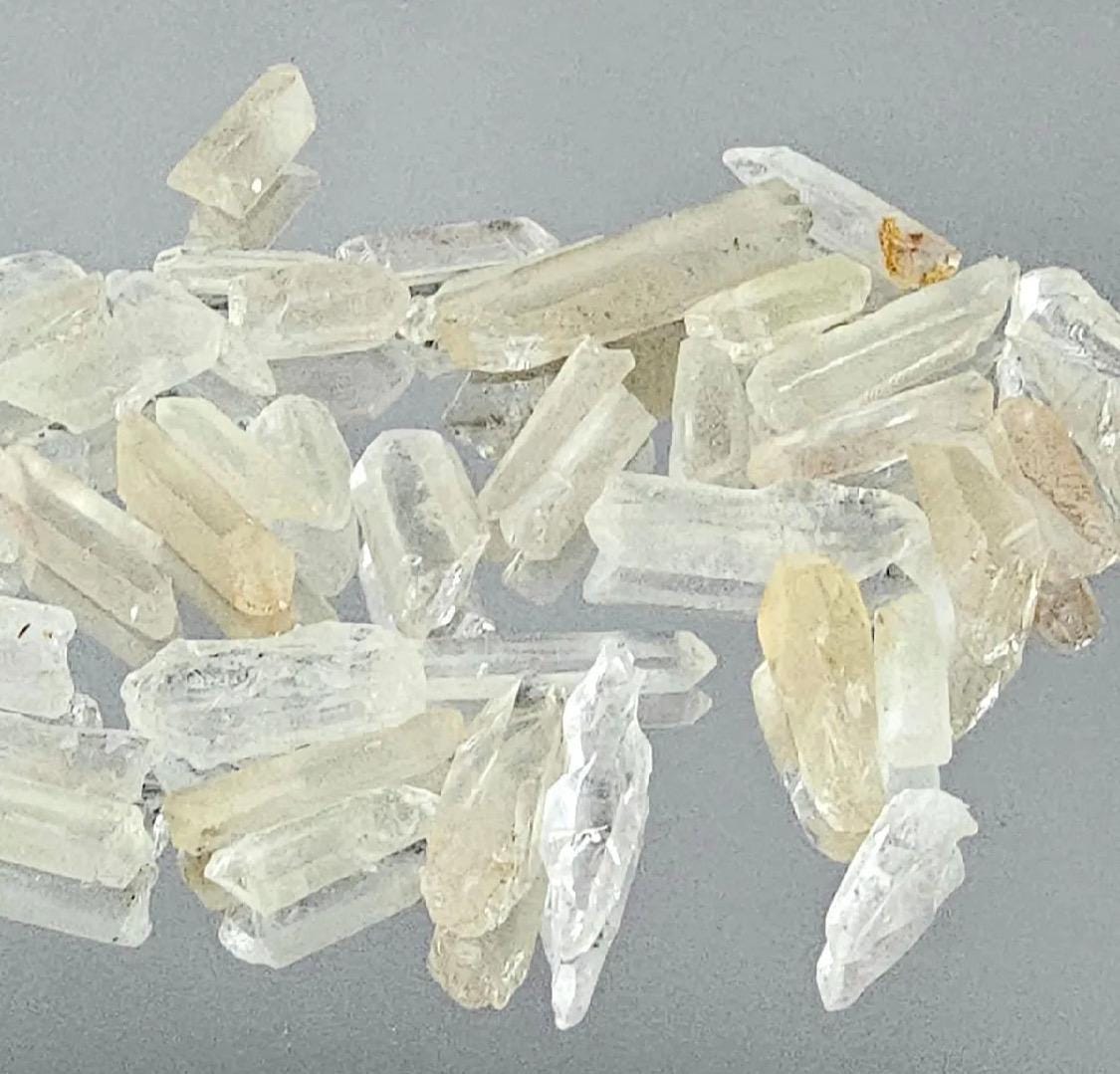 Unpolished raw quartz points showing natural terminations and clarity