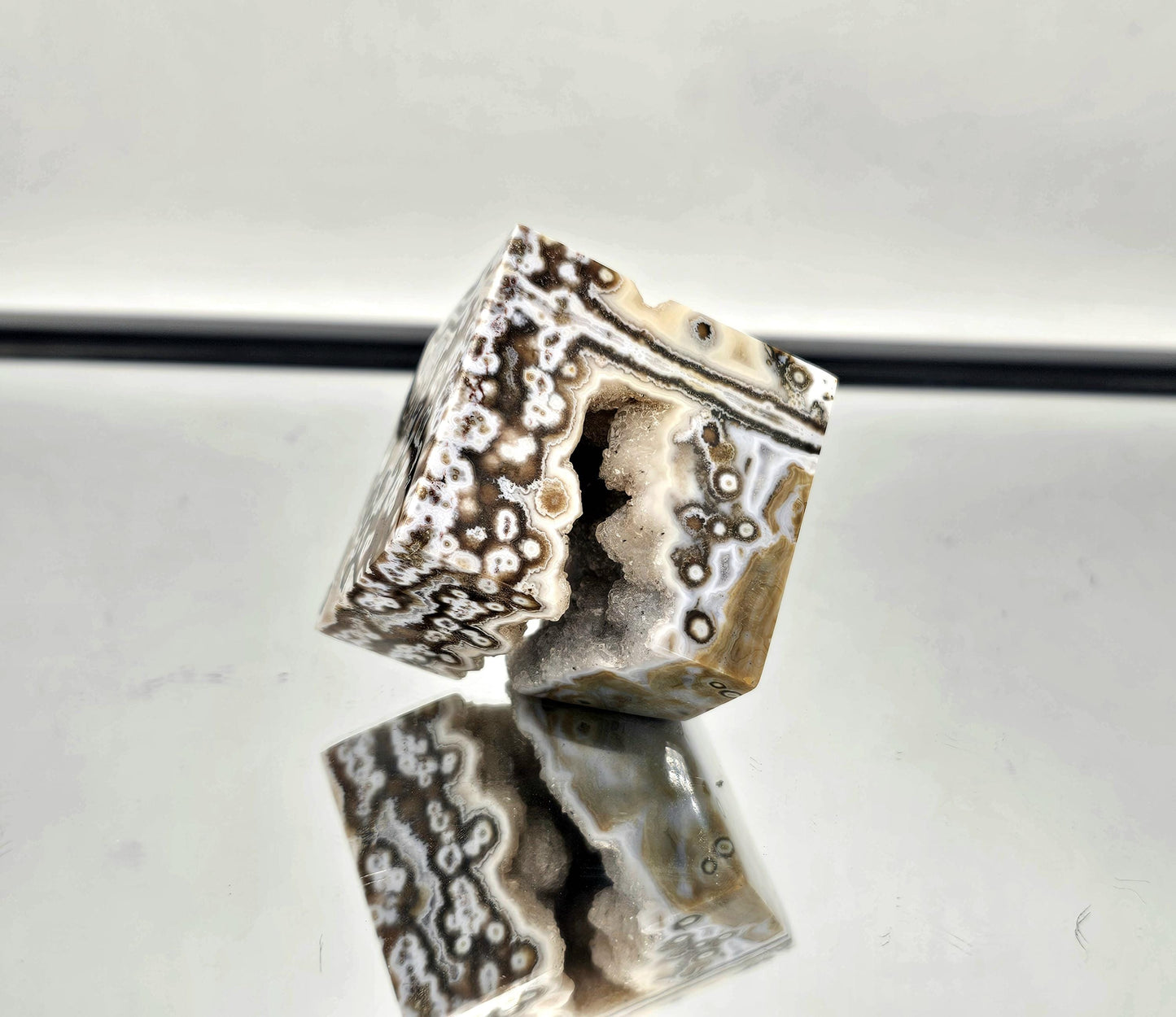 Ocean Jasper crystal cube with hollow, showcasing vibrant colors and intricate patterns. Part of our handpicked collection.
