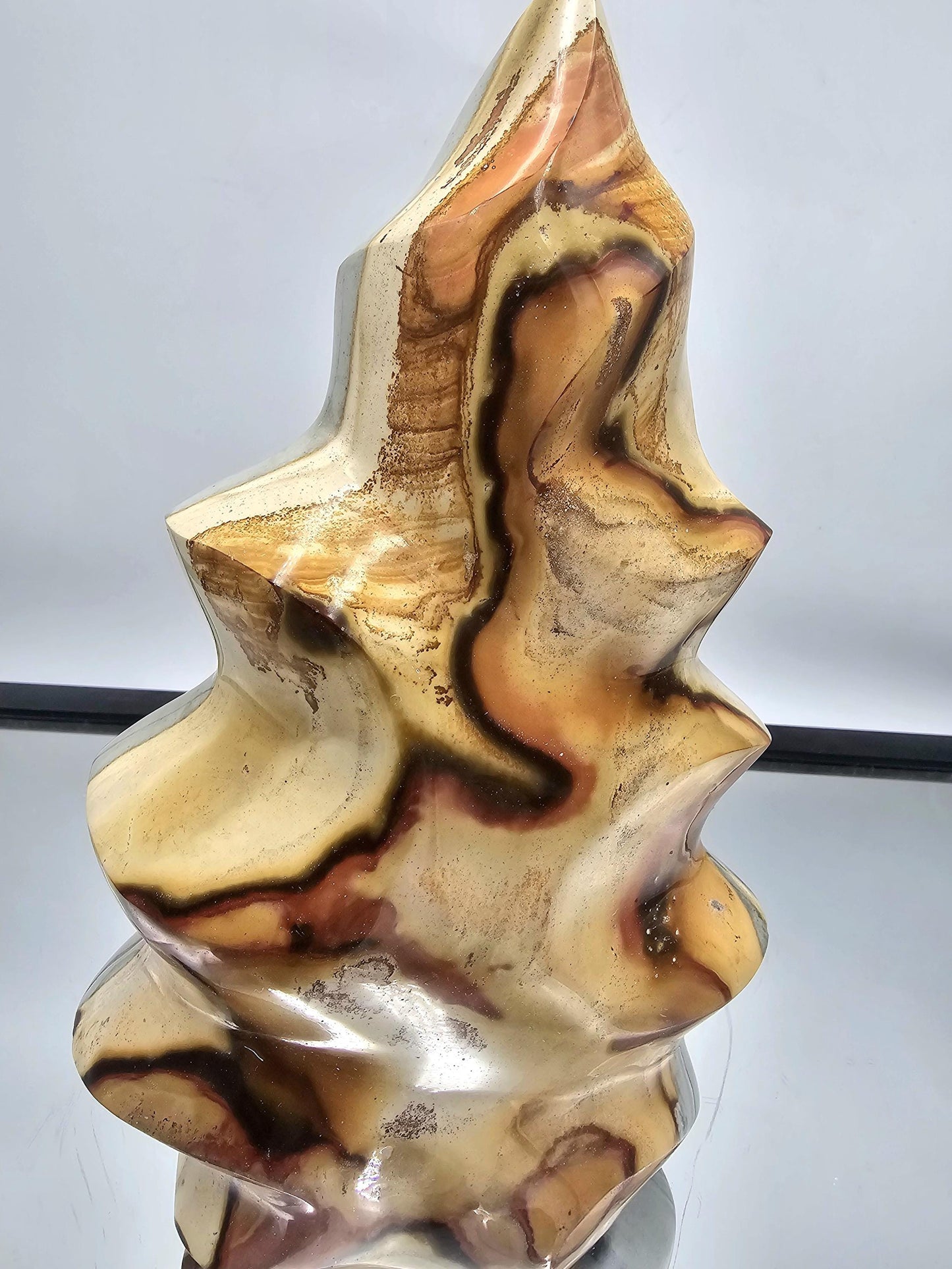 Natural ocean jasper flame sourced from Madagascar with unique swirling colors.