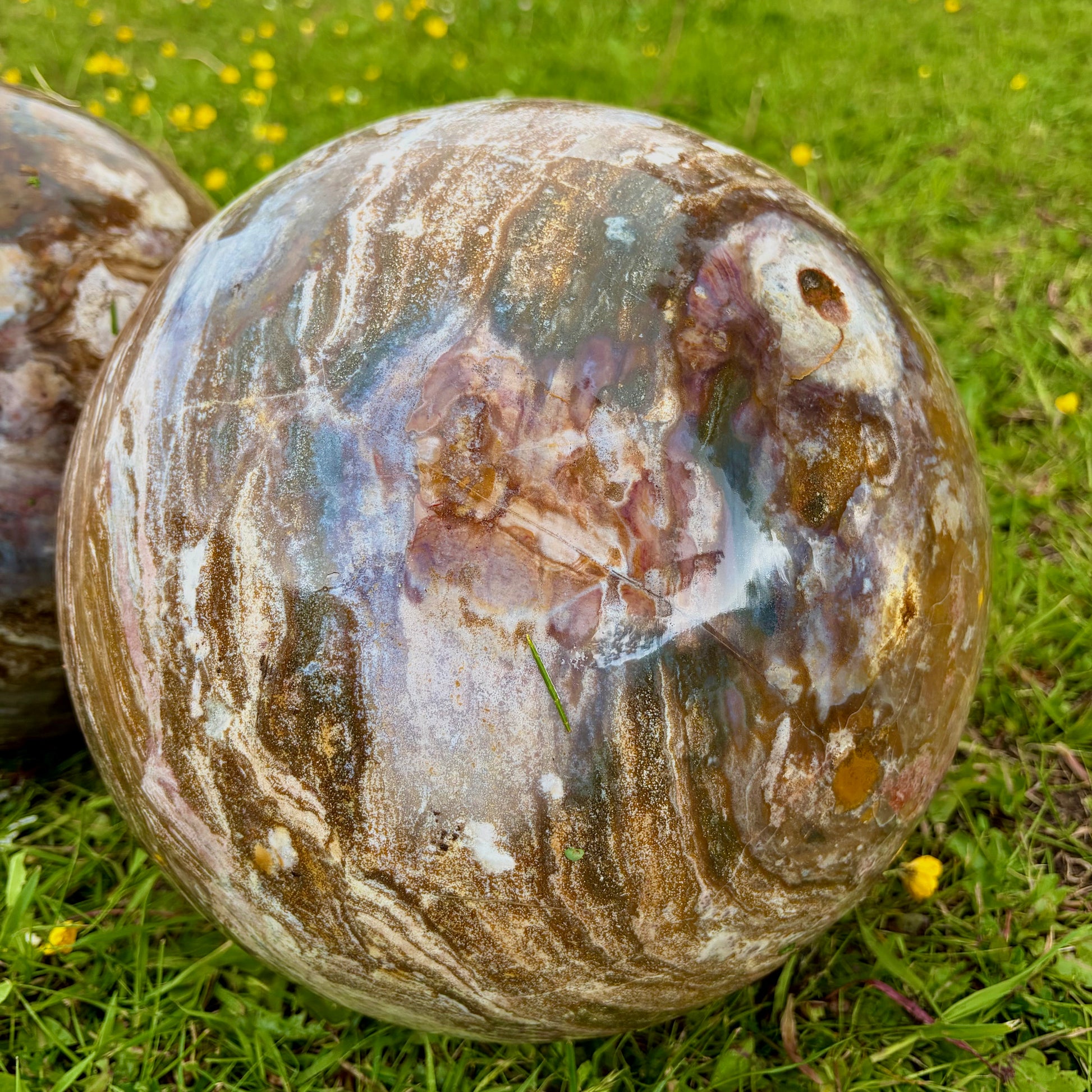 Close-up on a polished Ocean Jasper sphere.