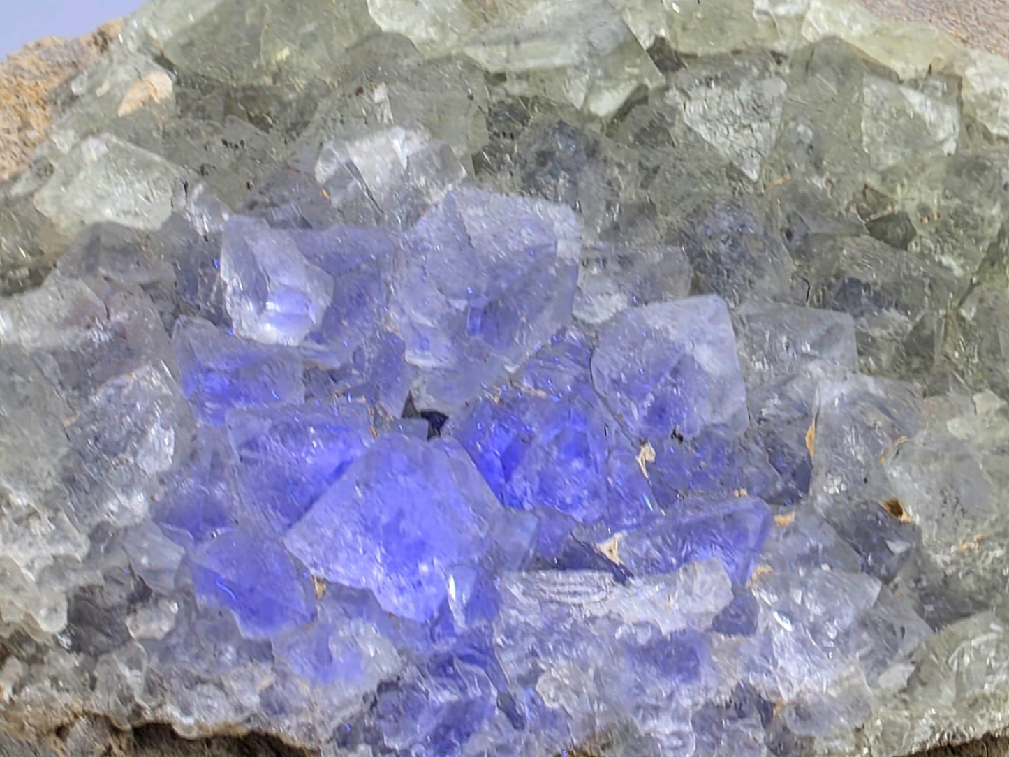 Close-up showing sharp octahedral fluorite crystal structure and clarity.