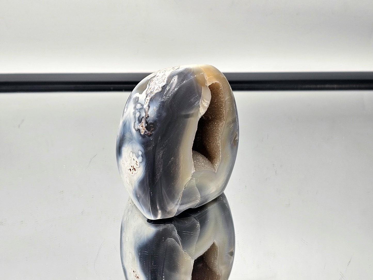 Stunning Orca Agate crystal freeform from Madagascar with unique blue and white hues and a hollow center.