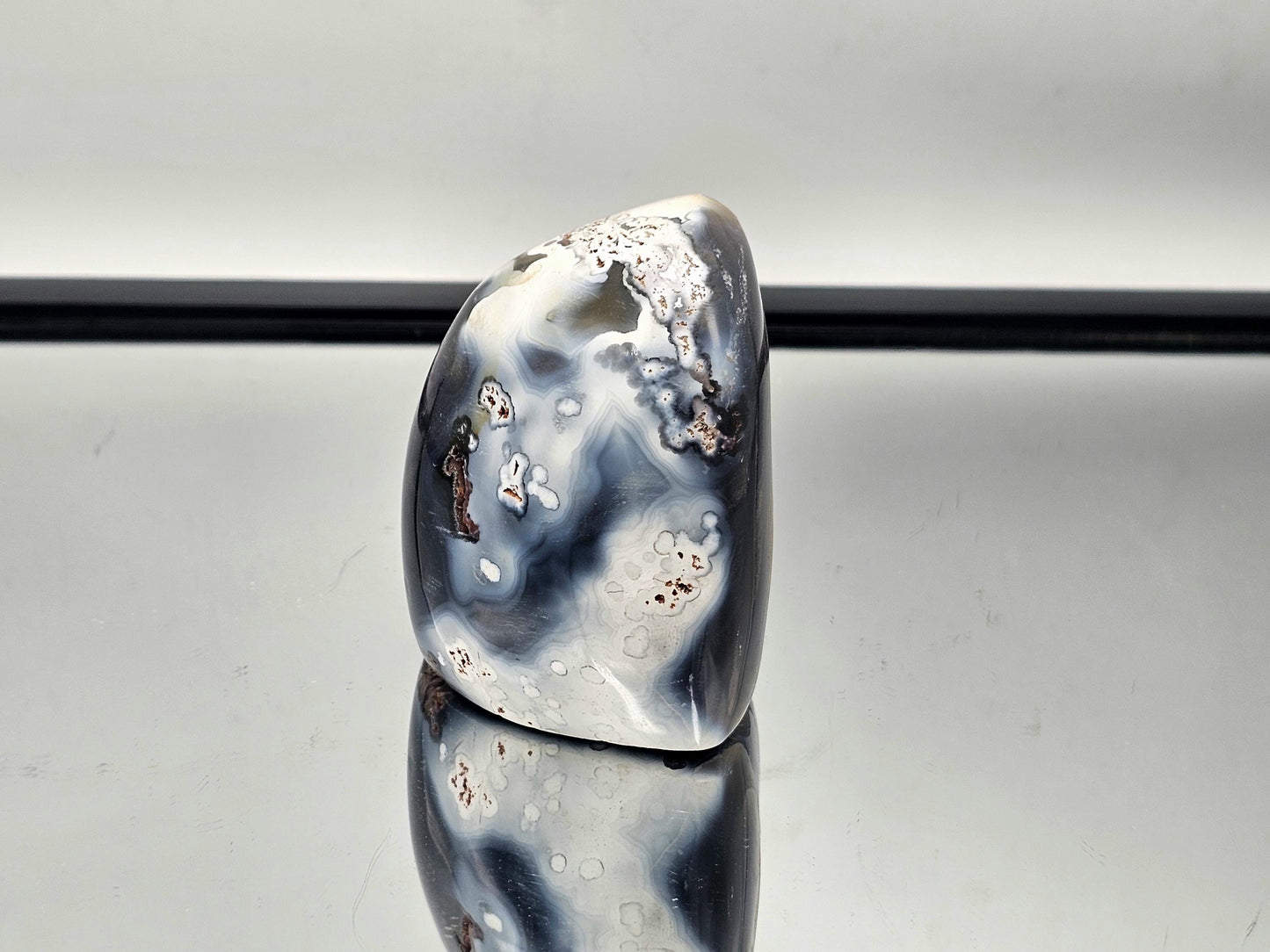 Beautiful Orca Agate crystal freeform with a hollow center, showcasing its unique natural beauty.