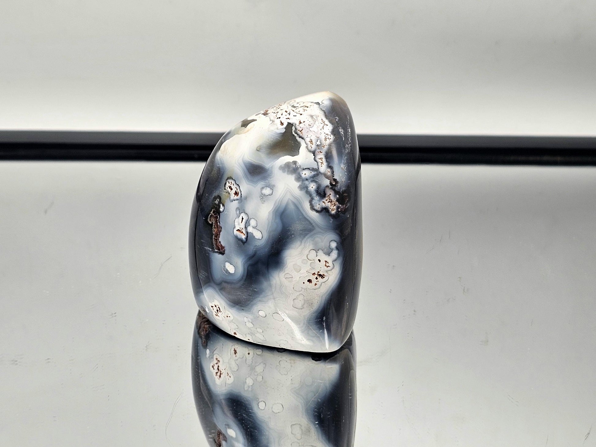 Beautiful Orca Agate crystal freeform with a hollow center, showcasing its unique natural beauty.
