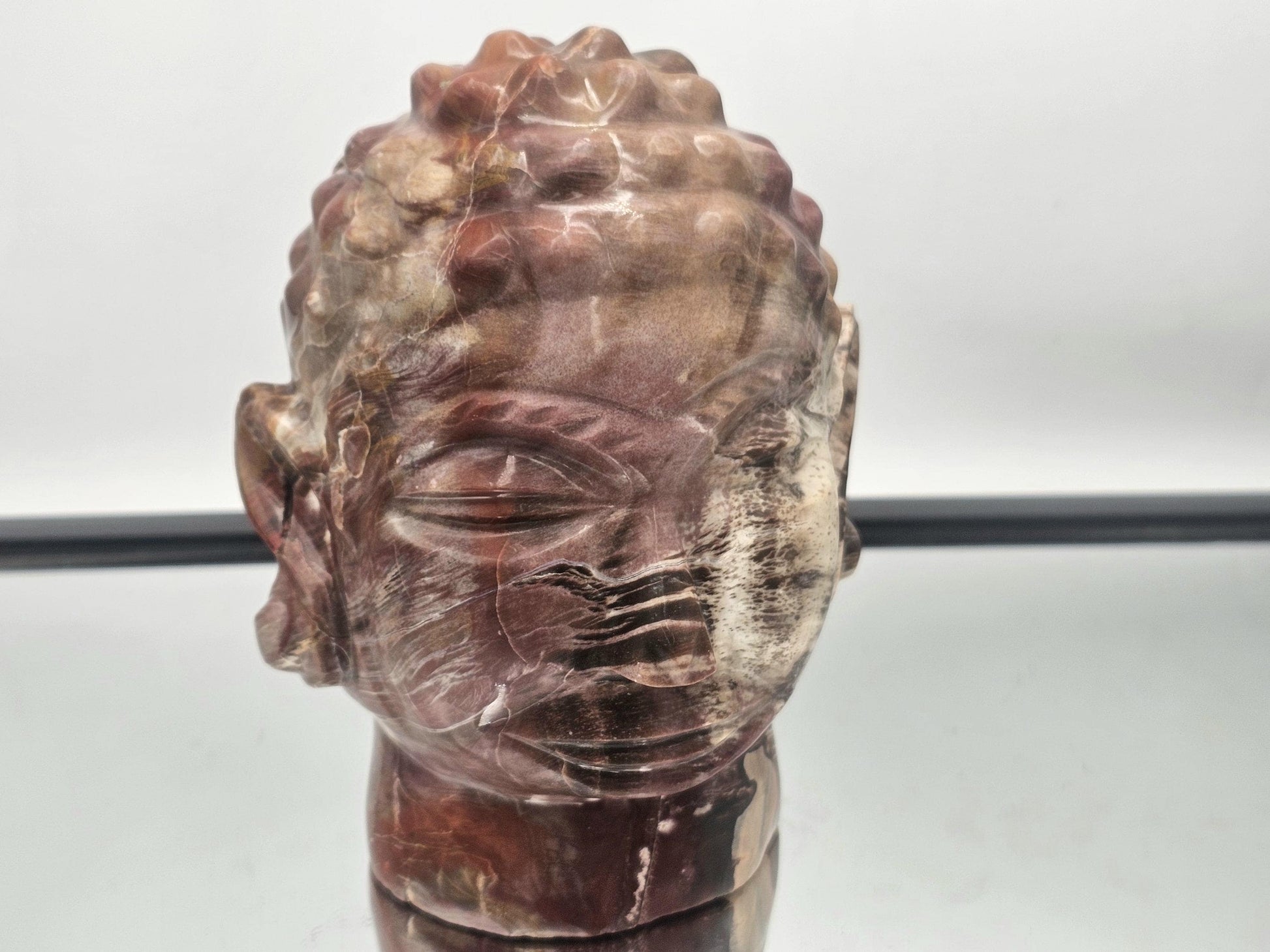 Stunning Fossil Wood Buddha statue featuring intricate hand-carved details and natural beauty.