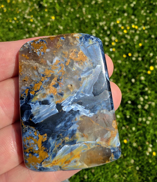 Large polished Pietersite with quartz veins.