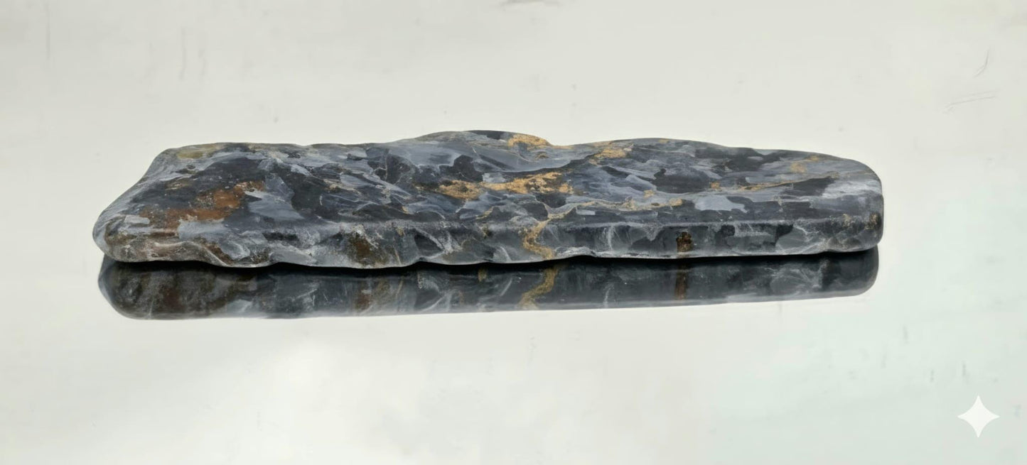 Natural gemstone showing swirling fibres.