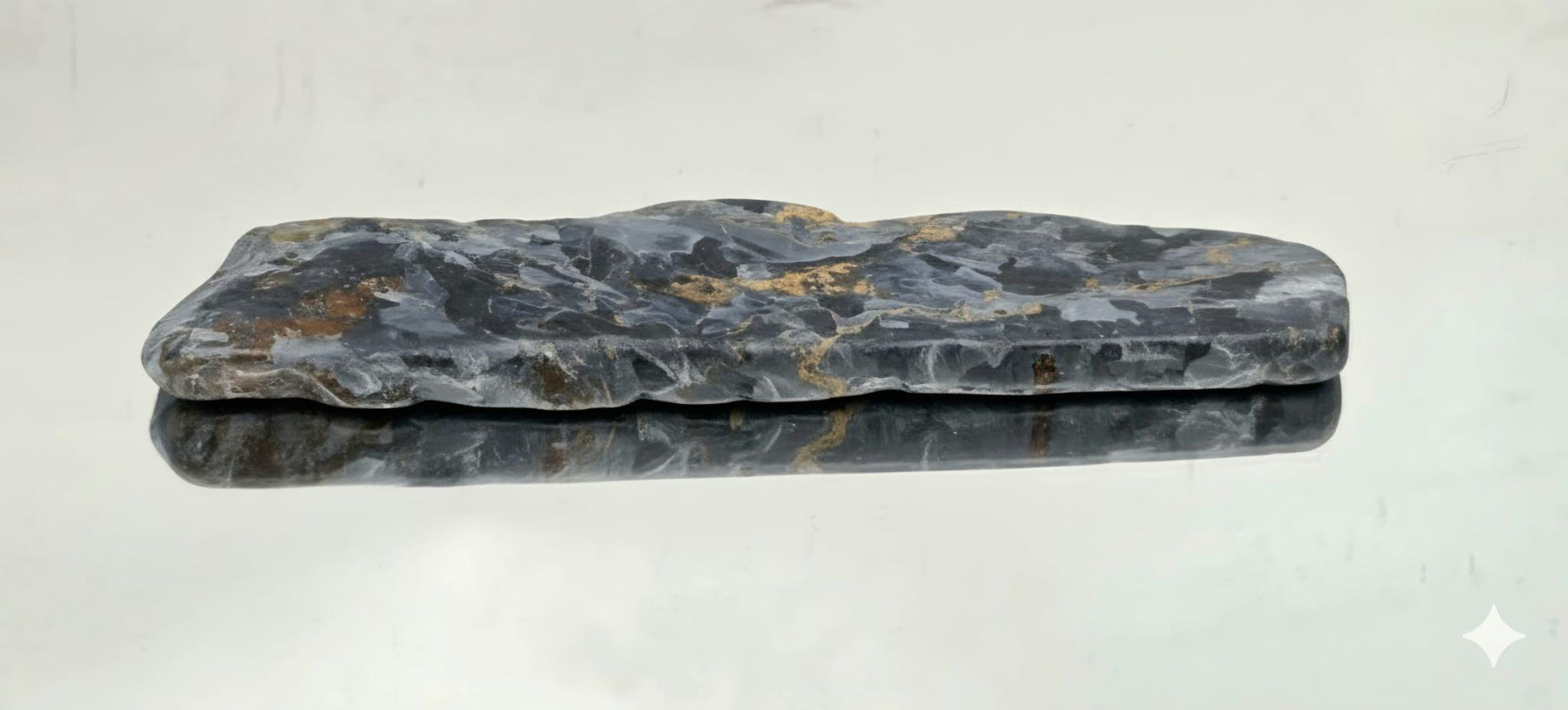 Natural gemstone showing swirling fibres.