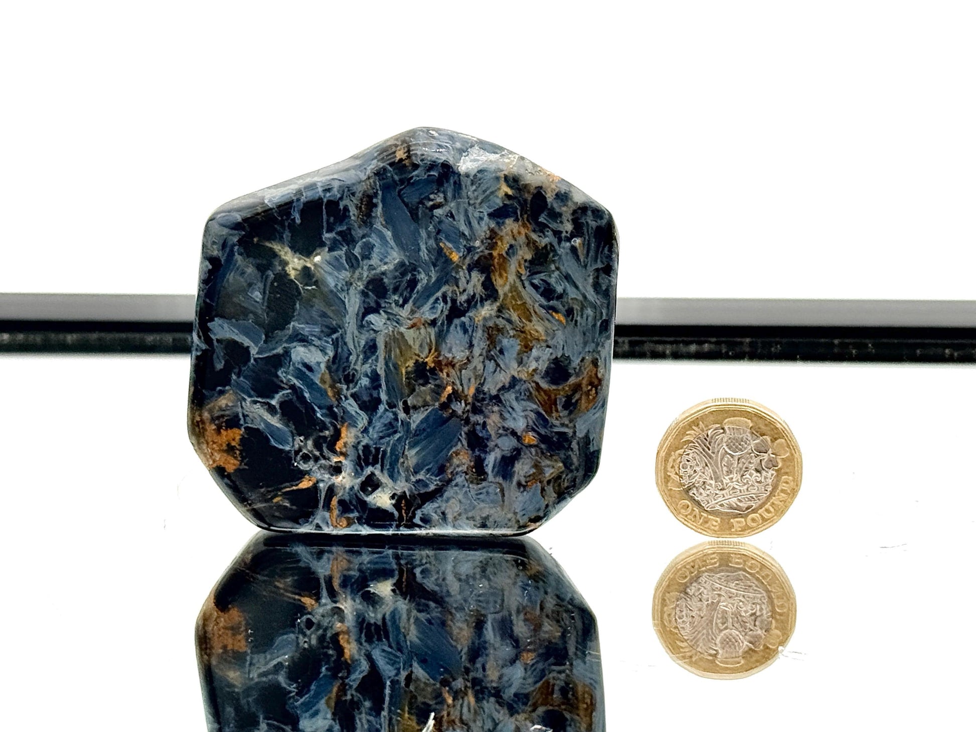 Natural pietersite slice showing swirling colours