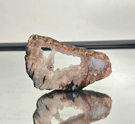 Pink Agate slice from Morocco, polished to a glossy finish.