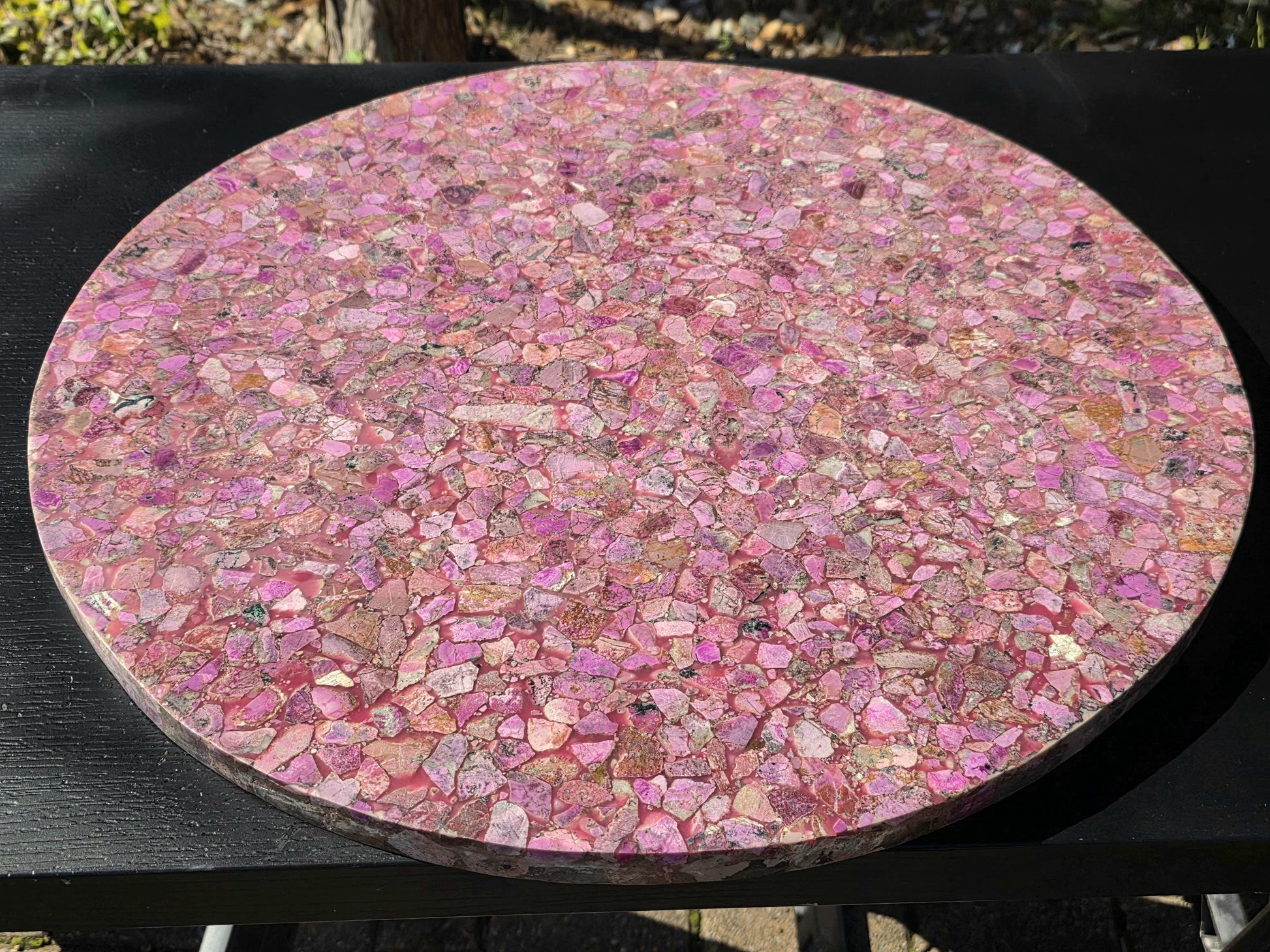 Artisan-finished pink calcite tabletop with gemstone inlay design.