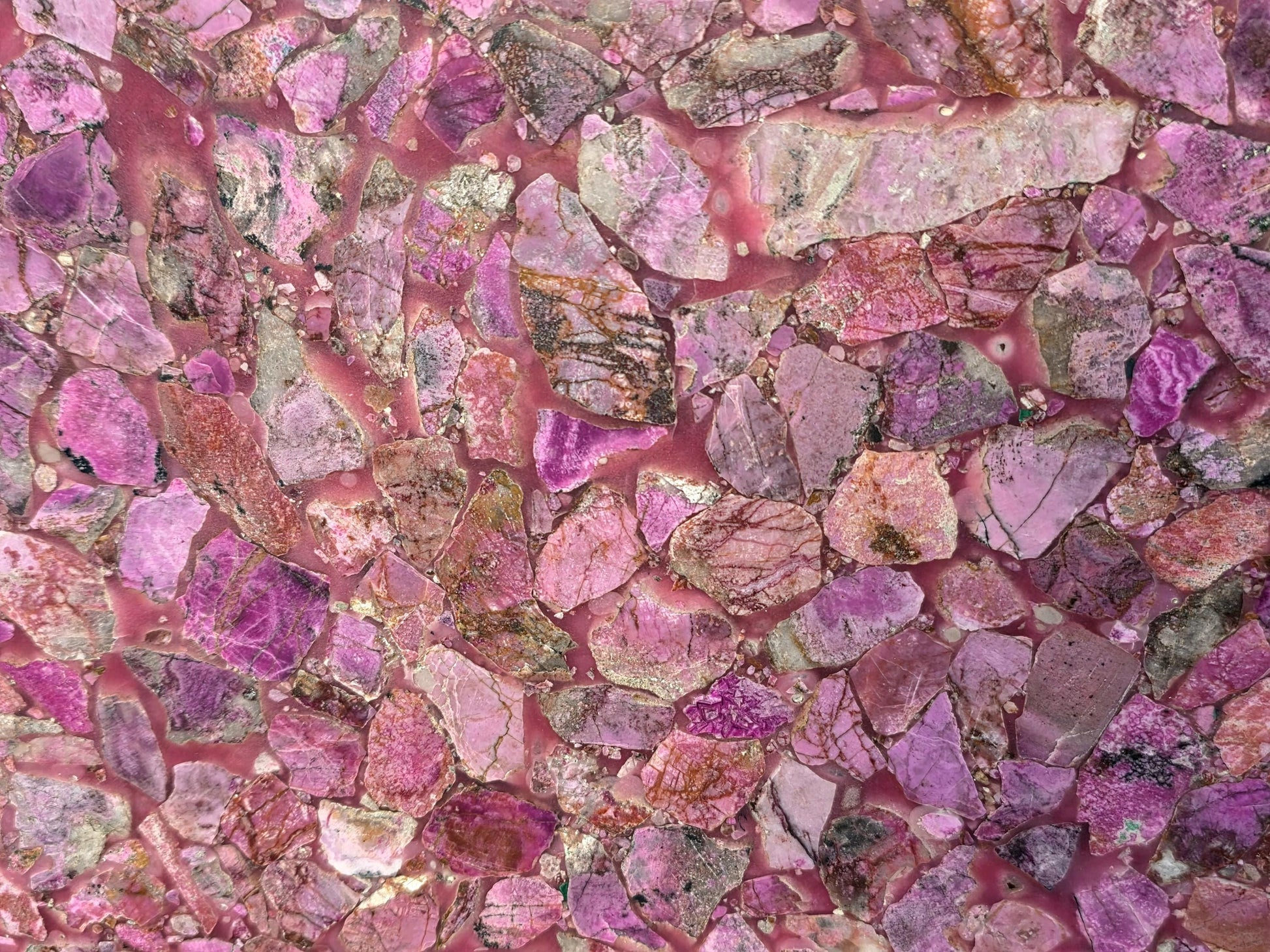Pink calcite gemstone table designed for sophisticated interiors.