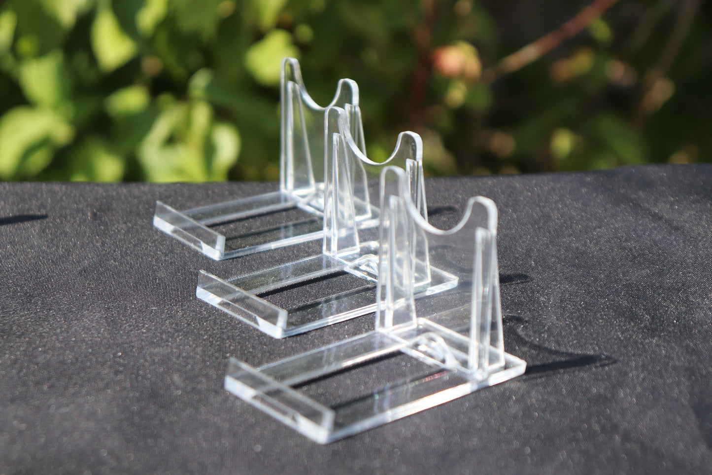 Clear plastic twist-together display stands in a set of three, suitable for holding crystals, minerals, and agate slices.