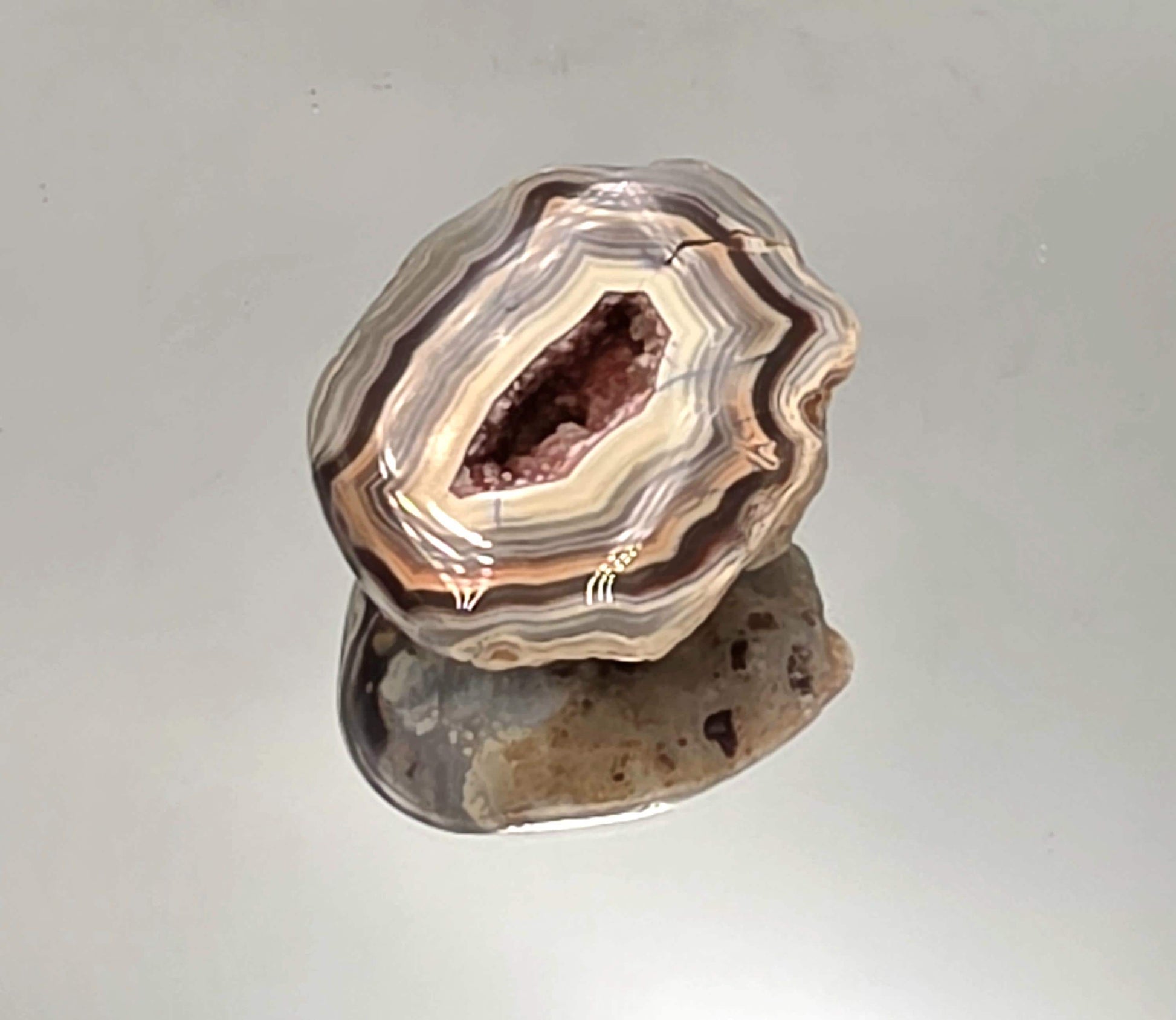 Polished Malawi Agate geode pair with banded layers.