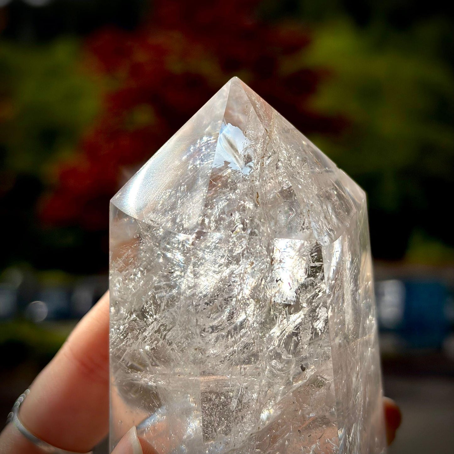 Polished clear quartz tower display piece with tall prism shape for modern interior styling.