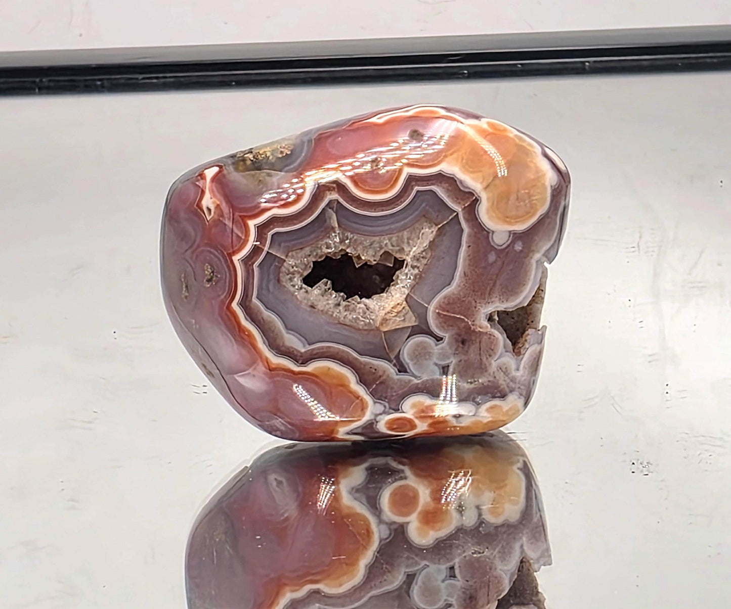 Polished crystal display Malawi Agate geode.