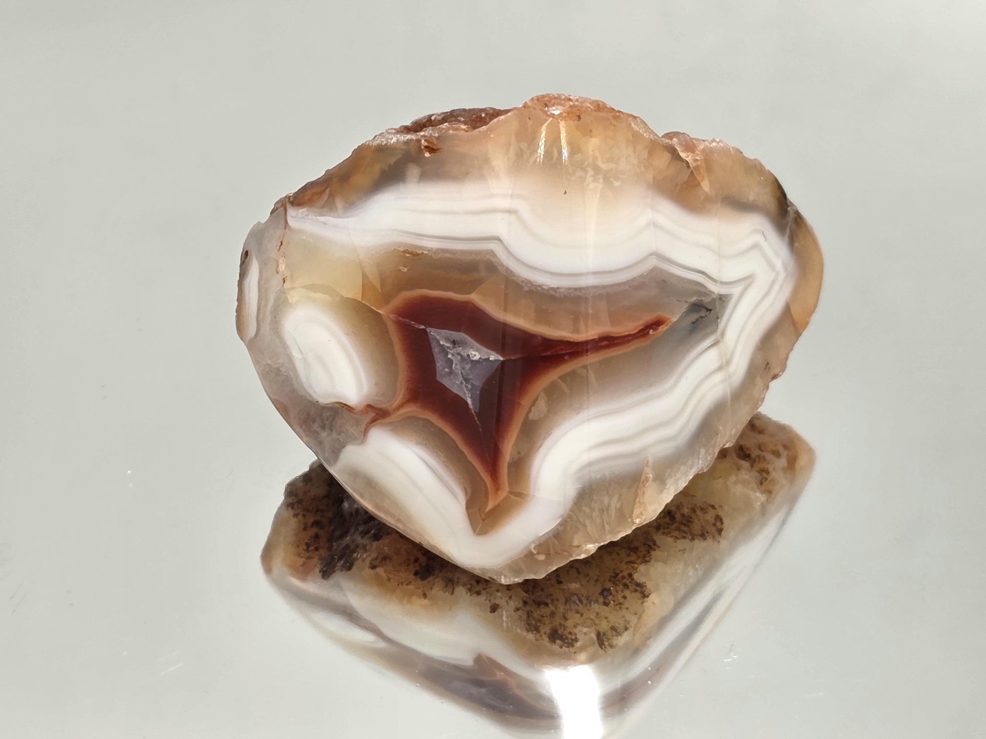 Polished vibrant Malawi Agate crystal geode.