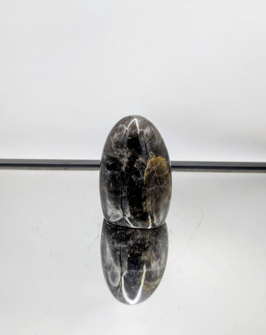 Polished Smoky Quartz freeform with deep, rich tones, found in Madagascar.