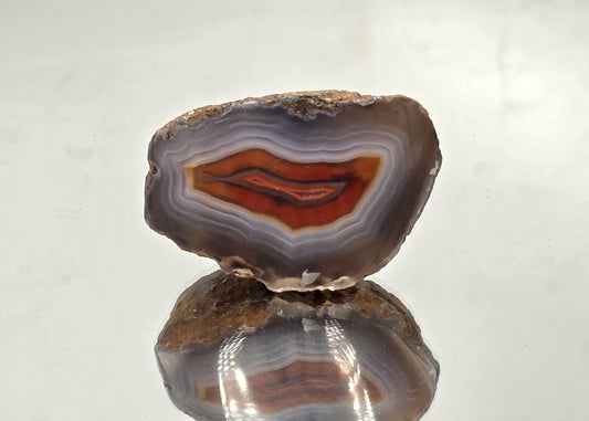 Polished decorative Malawi Agate crystal geode.