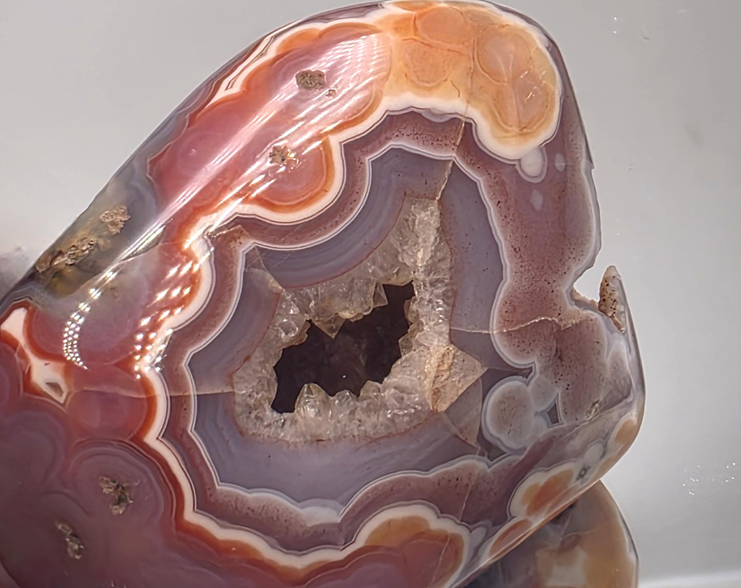 Polished display Malawi Agate banded geode.