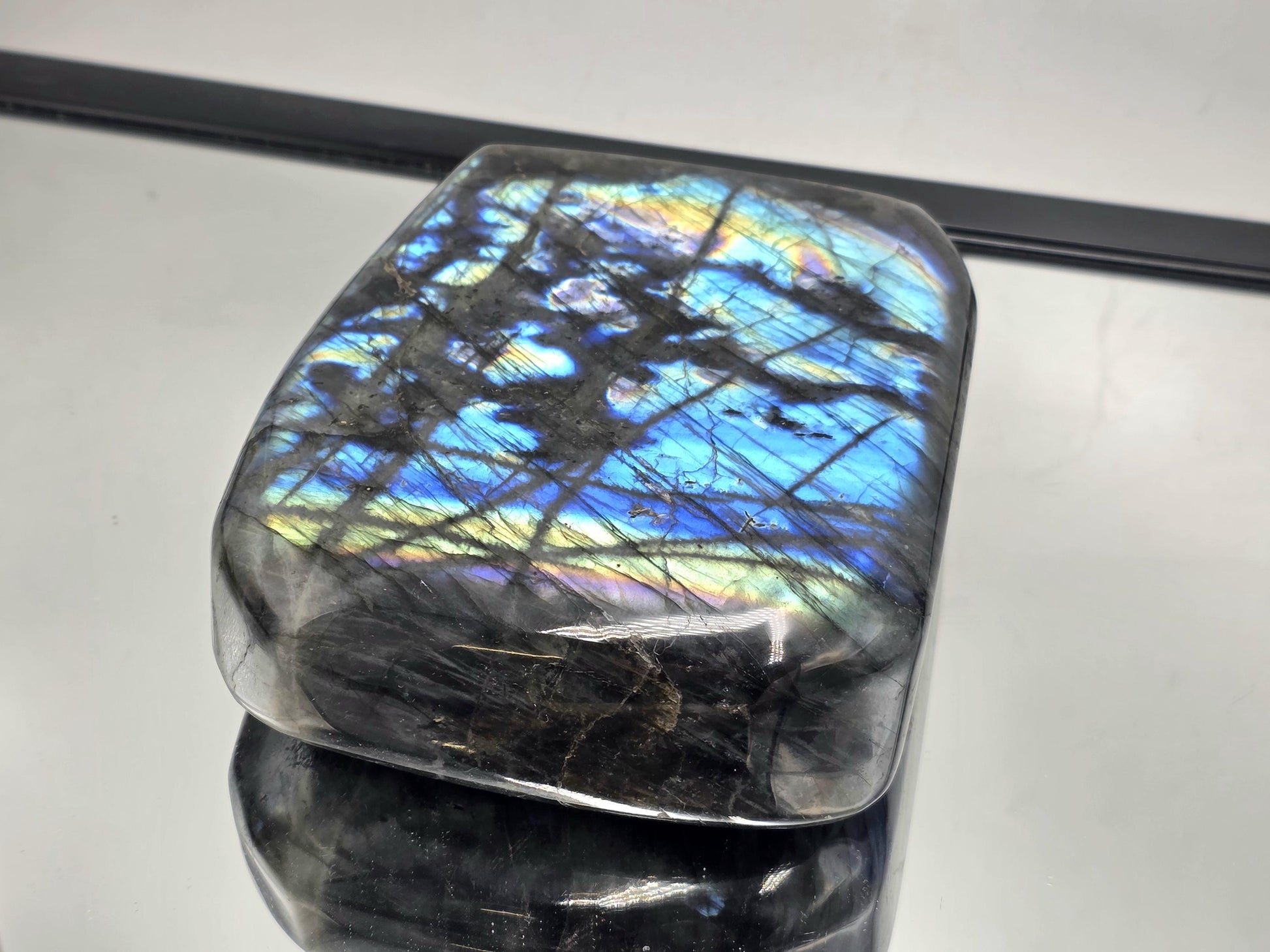 Polished Labradorite Freeform crystal with striking flash and smooth finish, a standout addition for collectors.