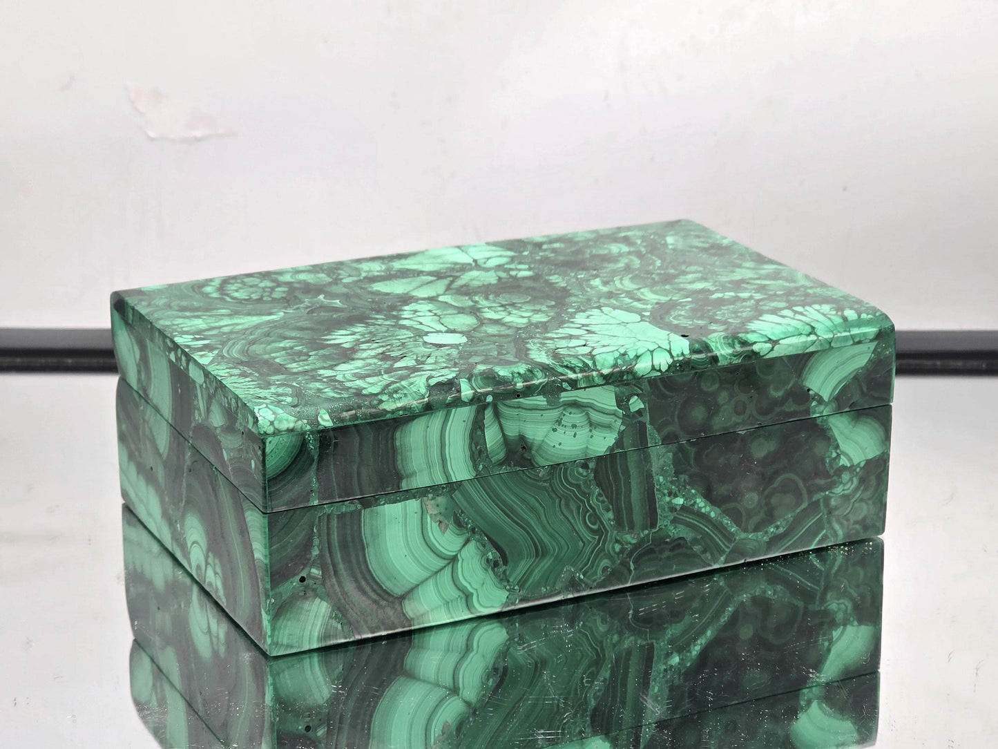 Polished Malachite storage box showing green banded patterns