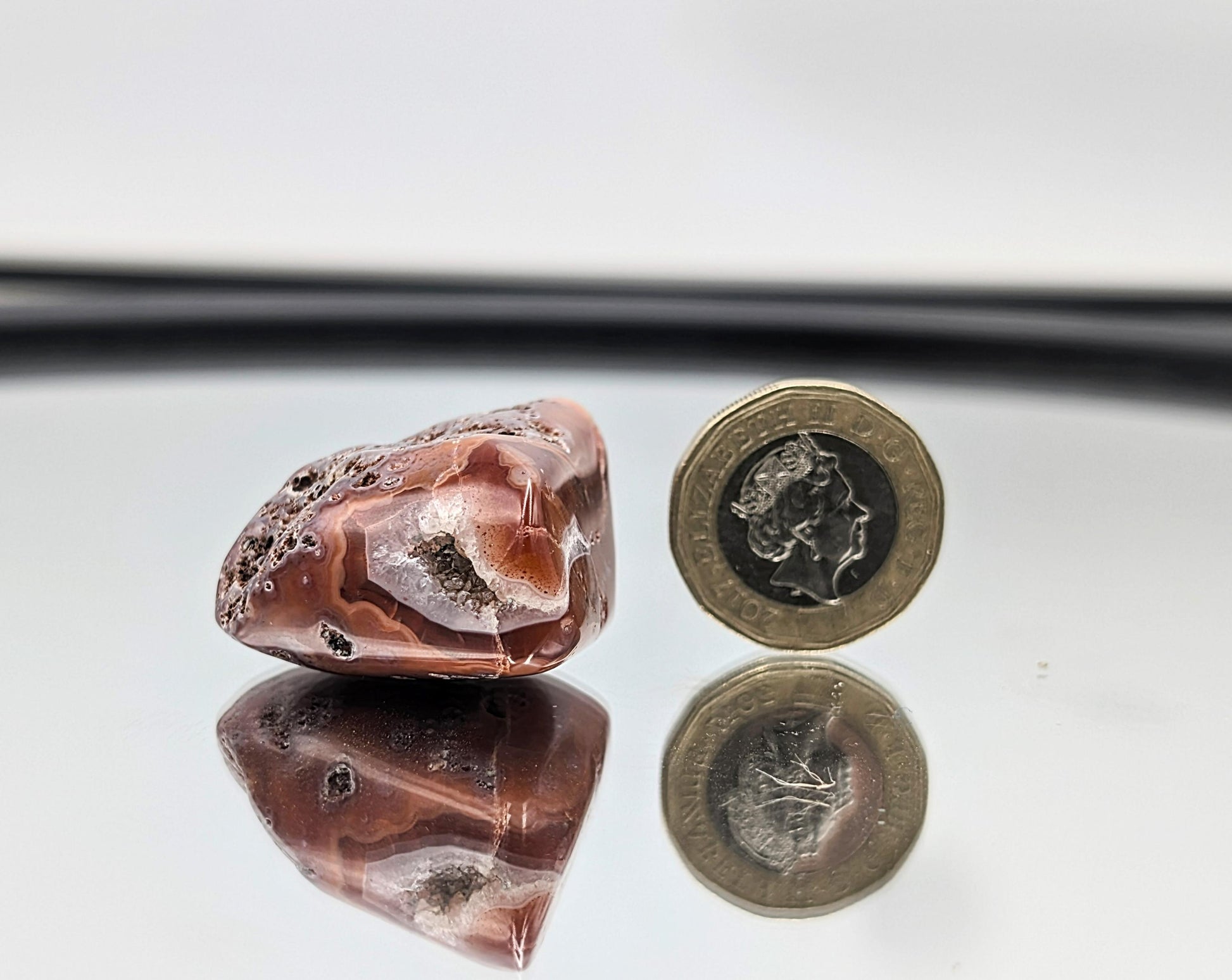 Shiny polished Malawi Agate crystals with layered textures.