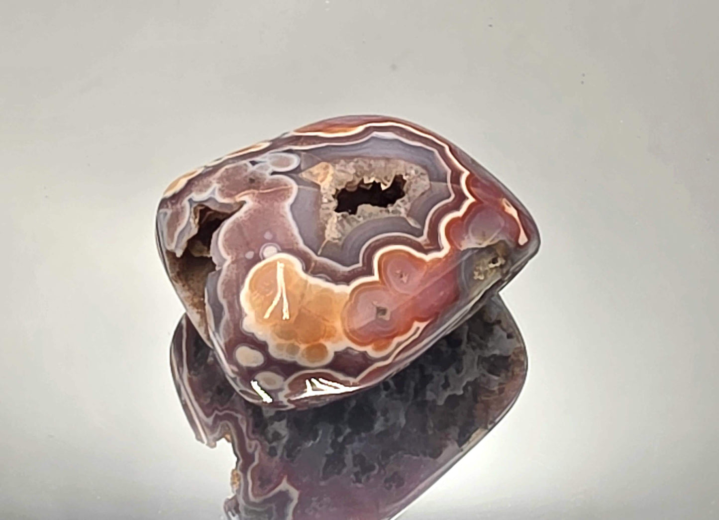 Polished Malawi Agate display crystal geode.