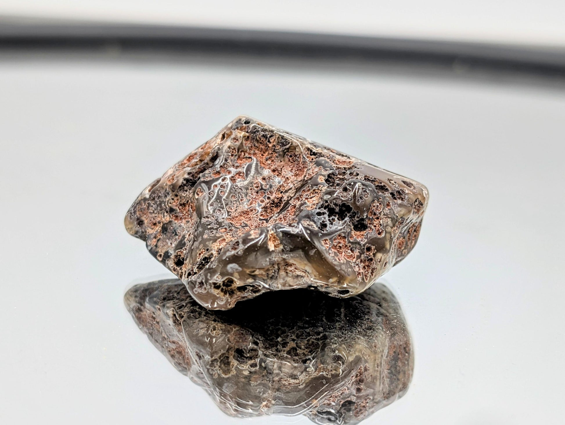 Polished Malawi Agate stone with intricate designs.