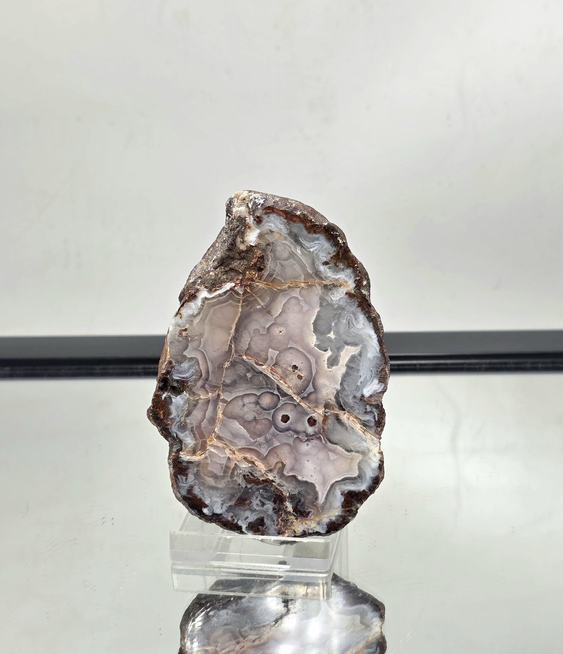 Polished Mexican Agate Geode perfect as a decorative display stone.
