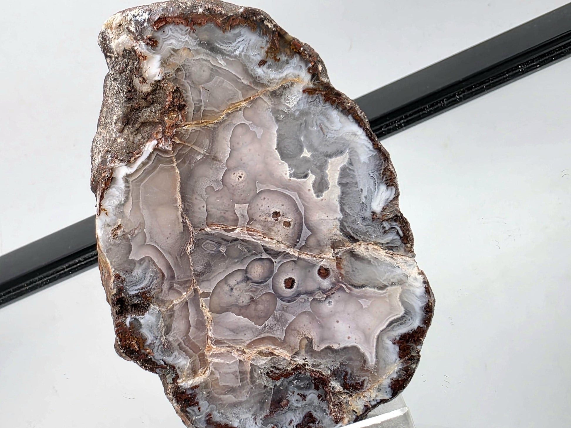 Polished Mexican Agate Geode with unique natural markings.