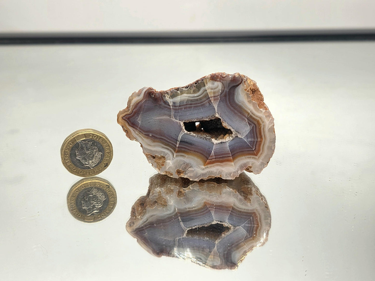 Polished natural Malawi Agate crystal geode.