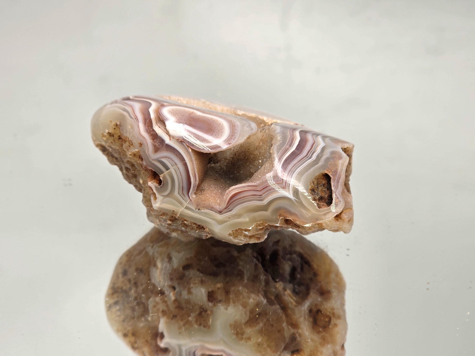 Polished natural Malawi Agate crystal geode.