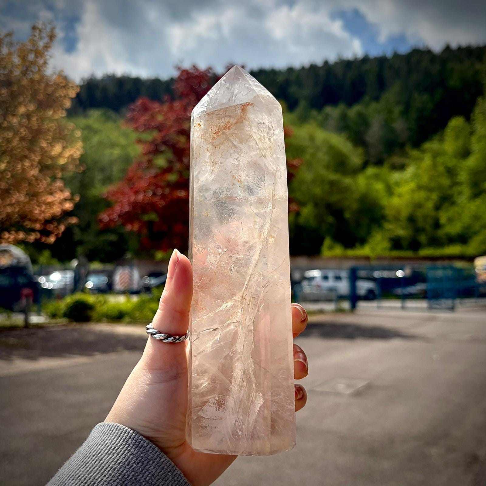 Polished quartz prism statement piece with clear tones, natural markings and display presence.