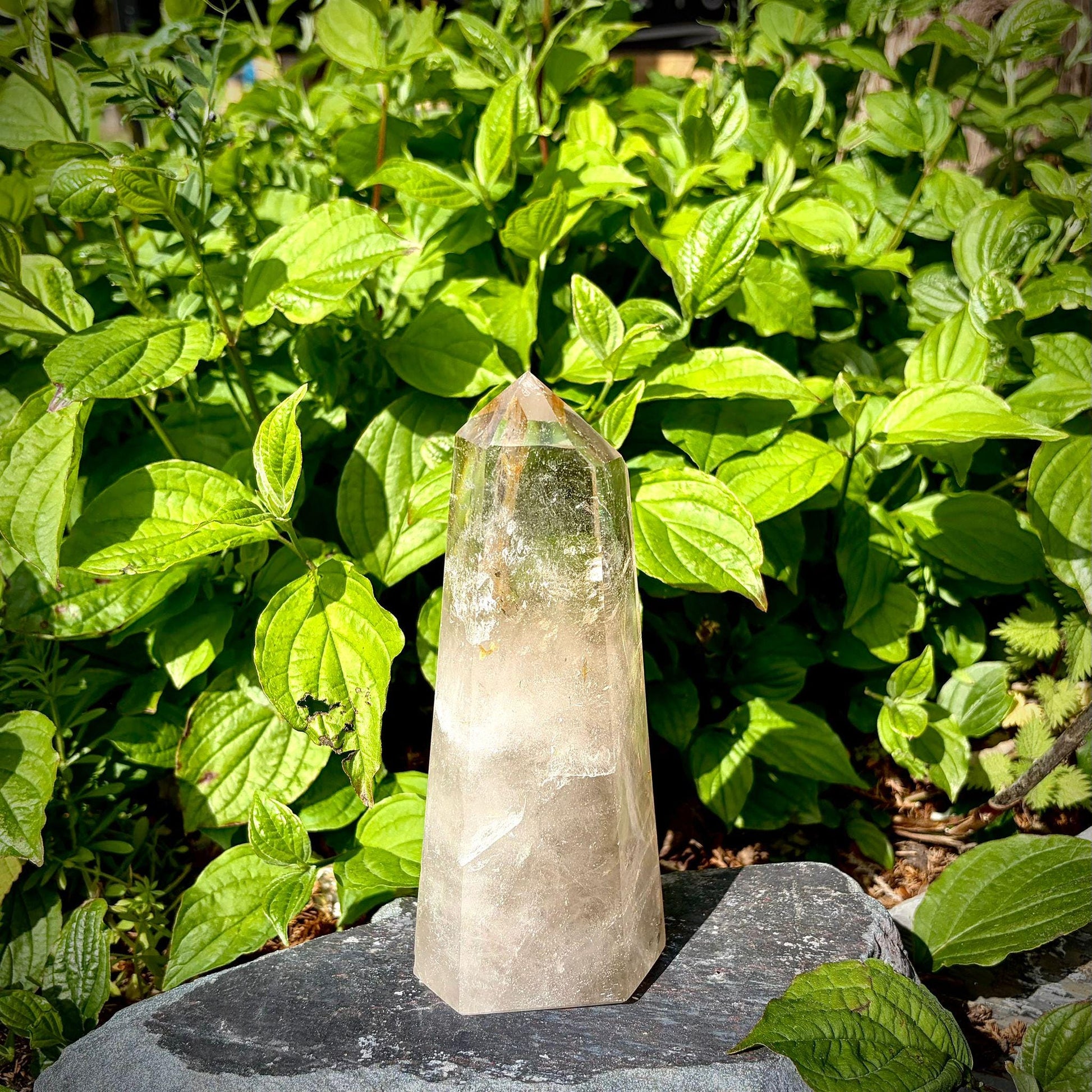 Polished quartz crystal tower for interior decor, showing natural formation and elegant shape.