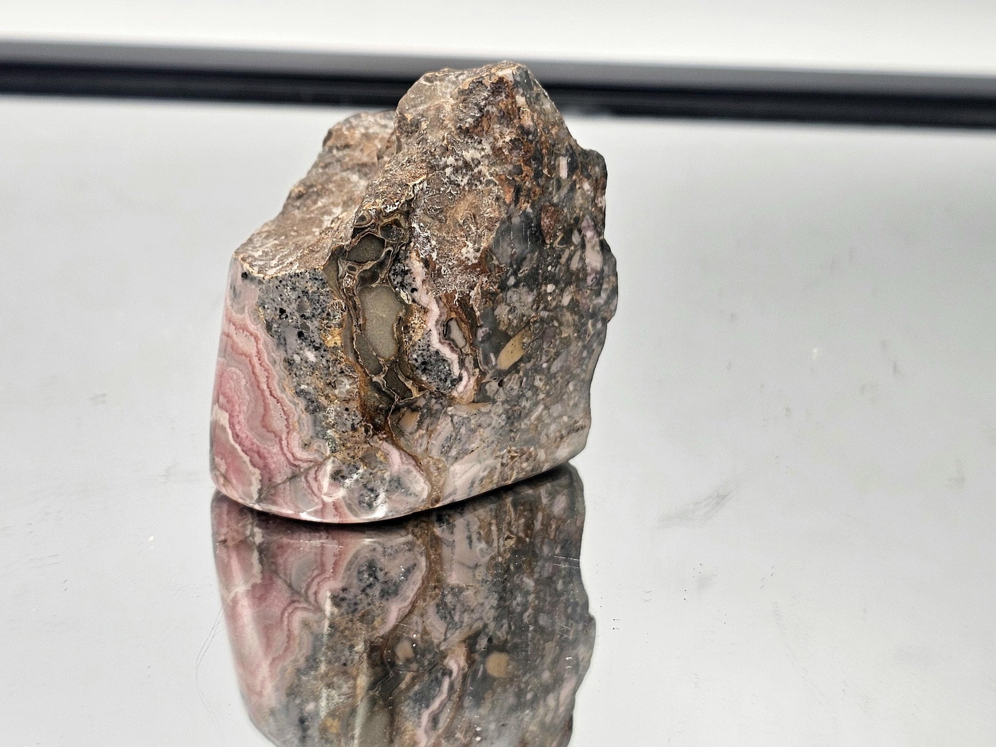 Beautiful polished Pink Rhodochrosite in natural matrix, part of our exclusive crystal collection.