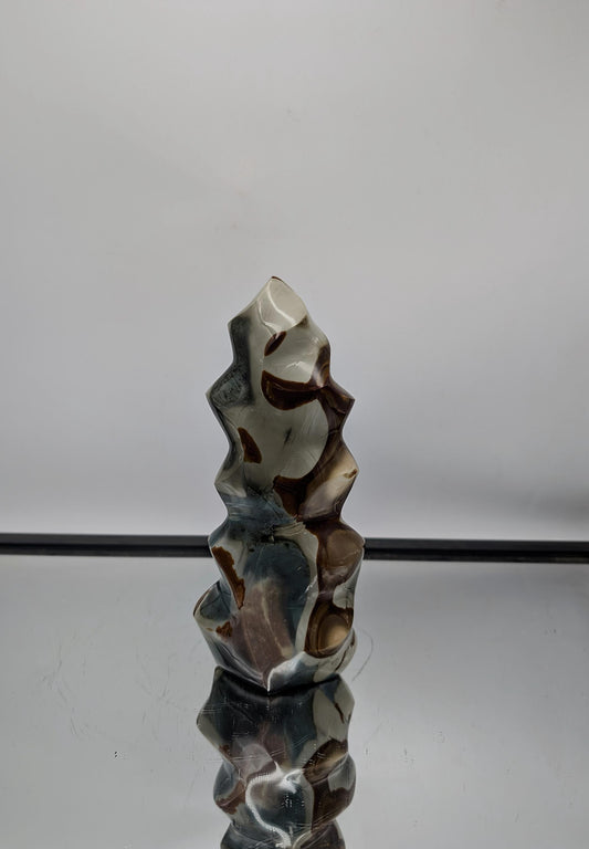 Large Polychrome Jasper Crystal Flame, hand-carved in Madagascar with vibrant colors.