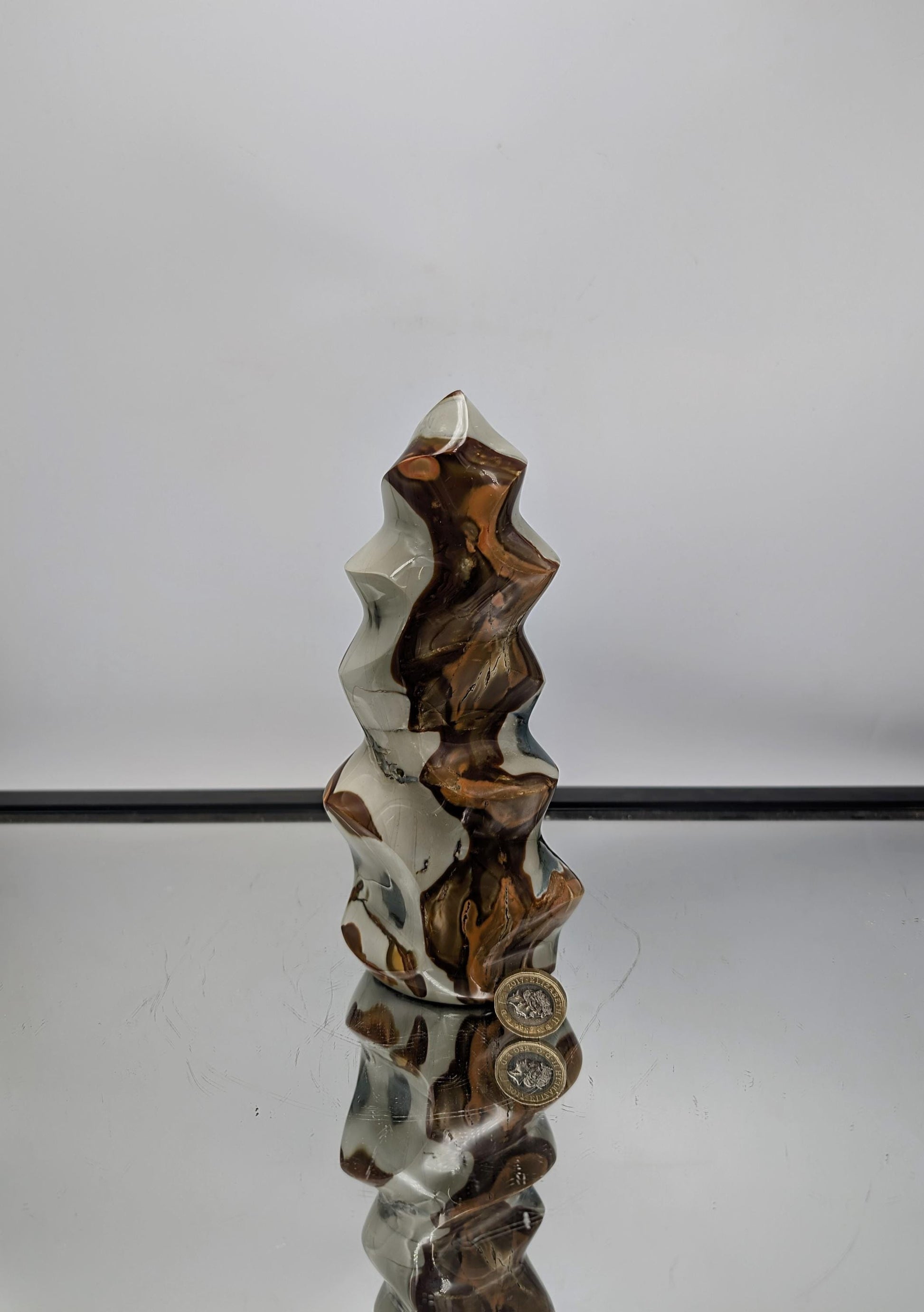 Elegant Polychrome Jasper Flame, a hand-carved crystal decor masterpiece.

