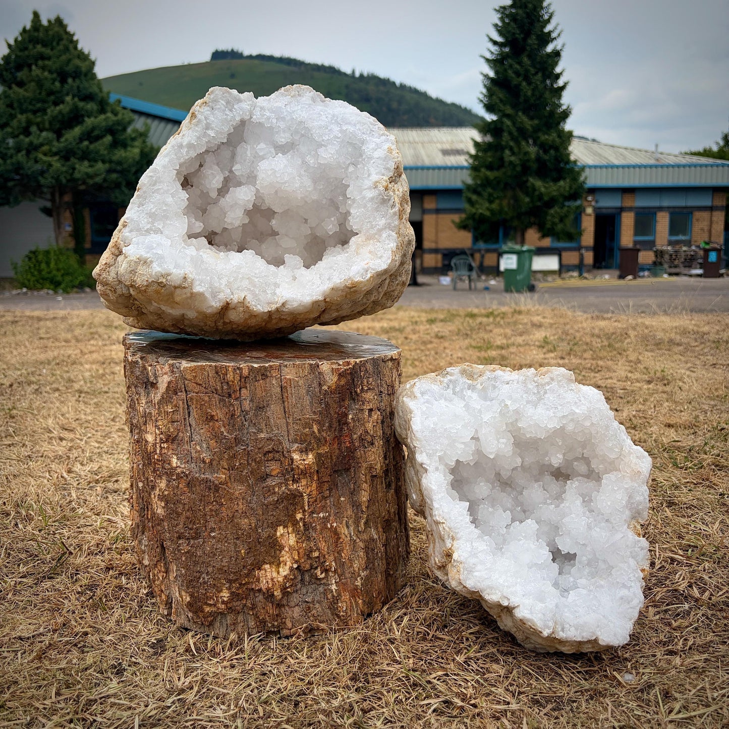 premium quartz crystal geode pair with matching crystal-lined interiors.