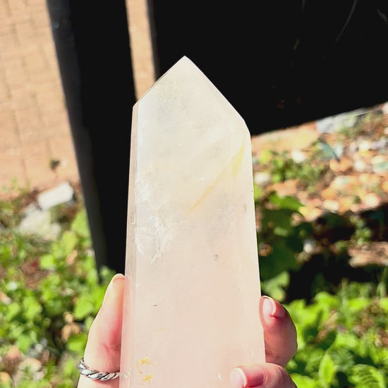 Clear quartz prism for natural home styling, with internal texture and elegant sculptural form.