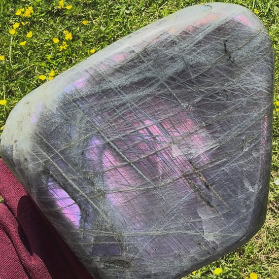 Video showcasing the shifting magenta and purple flash on a Madagascar labradorite freeform.