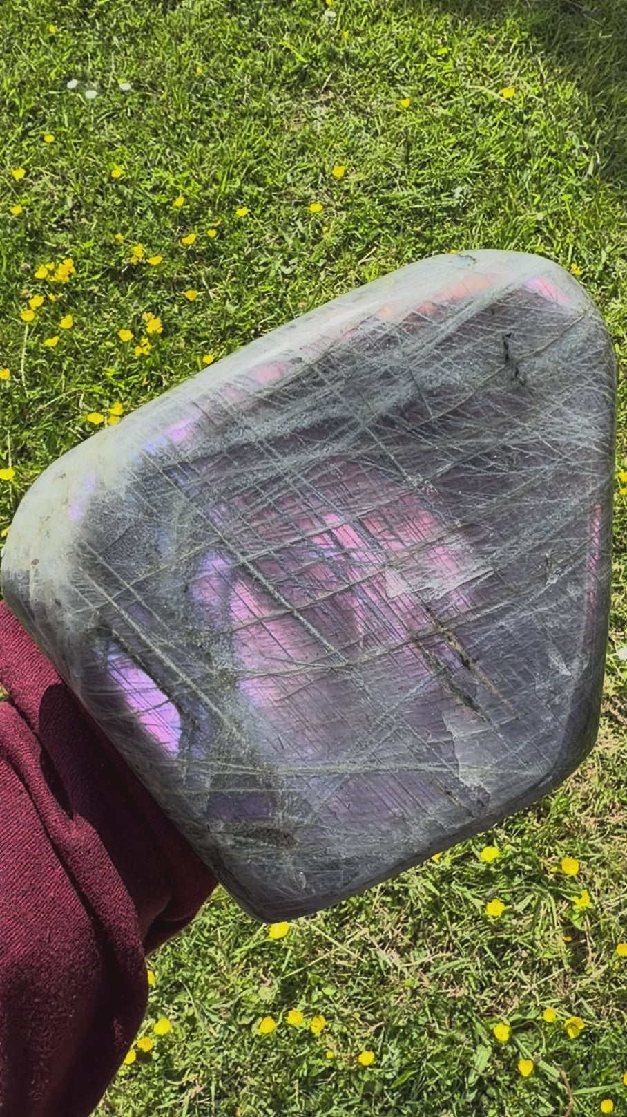 Video showcasing the shifting magenta and purple flash on a Madagascar labradorite freeform.