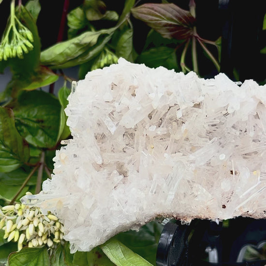 Video panning across Colombian Fine Needle Quartz to show its shimmering, light-reflecting lustre.