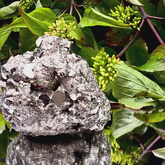 Video panning across a large Pyrite cluster to show its shimmering, light-reflecting crystals.