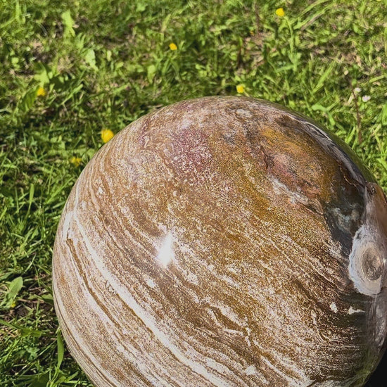 Video showcasing the 360-degree patterns and sparkling druse pocket of the Ocean Jasper spheres.